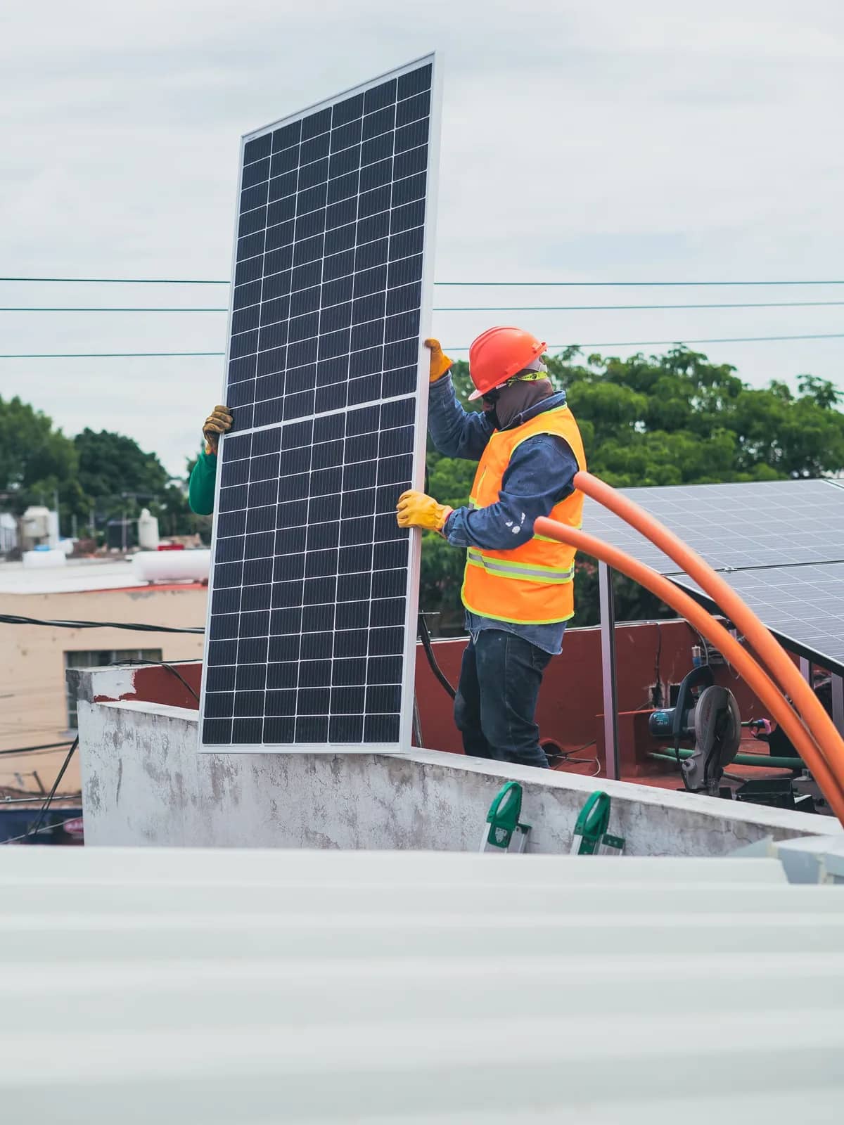 Field officer using a tablet on site during an infrastructure installation